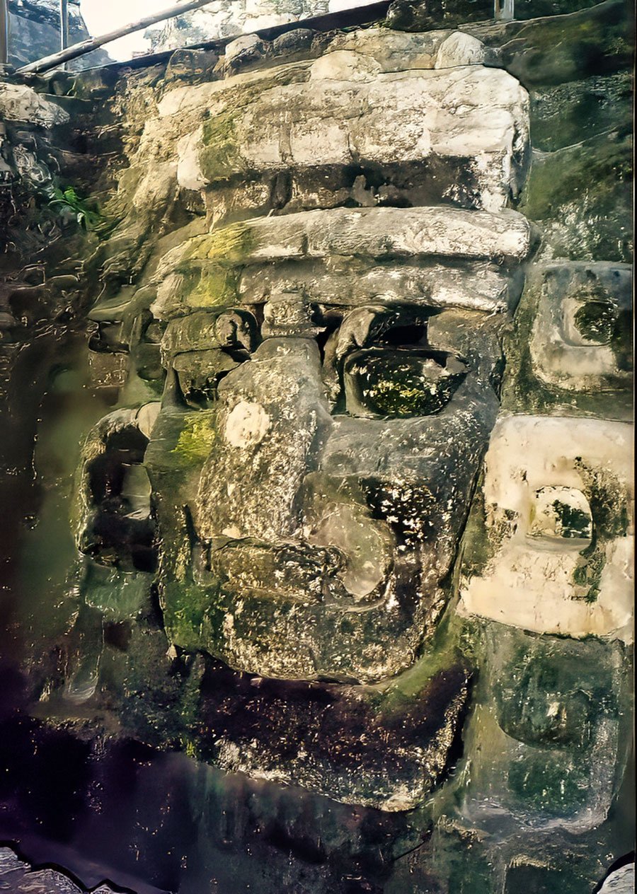 A detailed view of the Chack giant mask, the Maya rain God, situated in the north Acropolis of Tikal, showcasing intricate ancient craftsmanship.