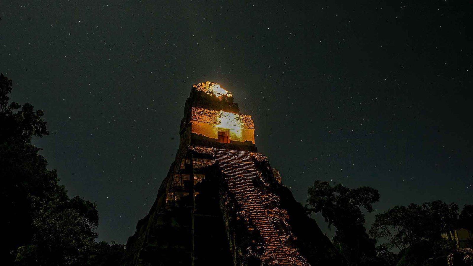 Tem,ple of the Great Jaguar wiht a starry sky, as a part of The History and Significance of Tikal